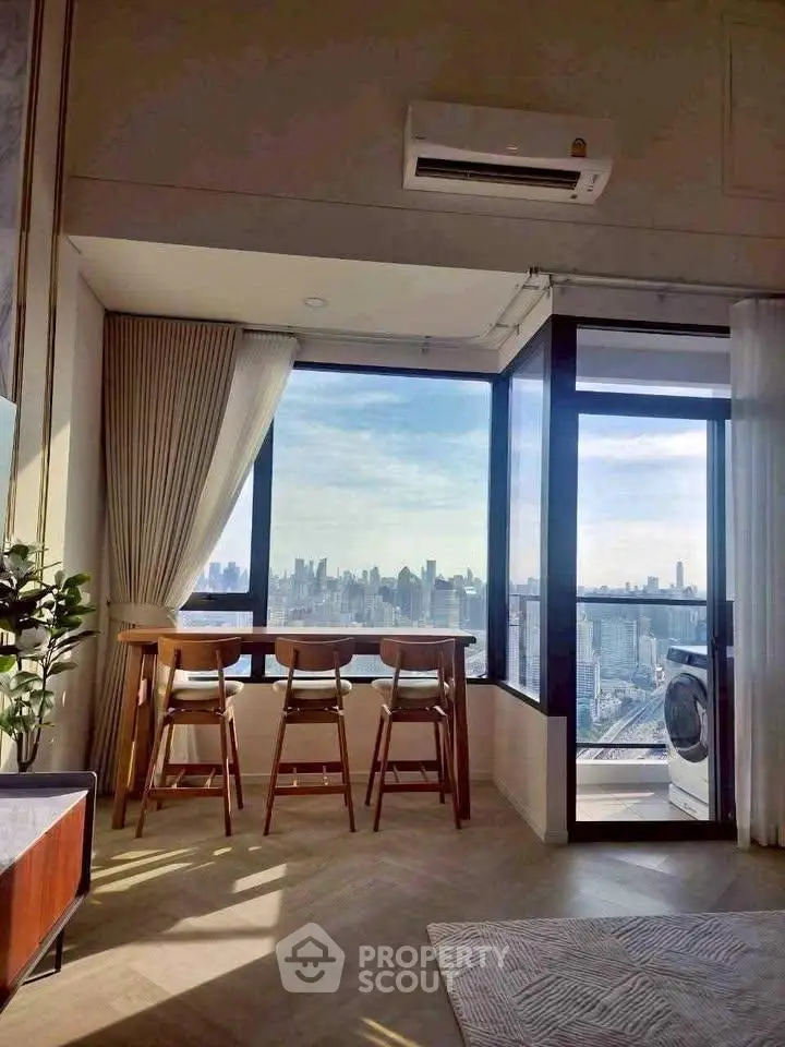 Stunning high-rise apartment with panoramic city views and modern interior design.