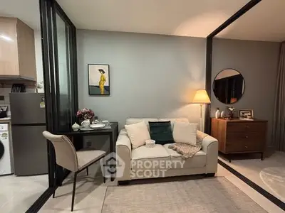 Cozy modern living room with stylish decor and open kitchen layout