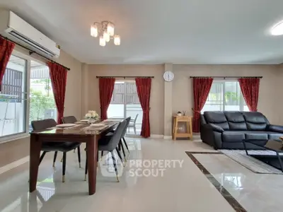 Spacious living room with elegant dining area and modern furnishings