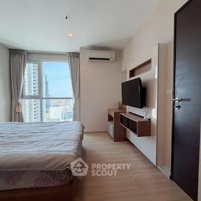 Modern bedroom with city view, featuring sleek furniture and natural light.