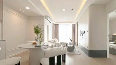 Modern living room with elegant dining area and natural light
