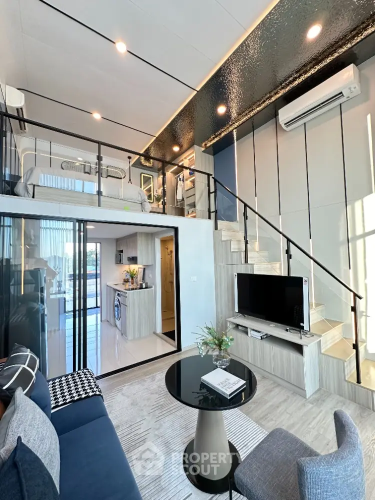 Modern loft apartment with stylish interior, featuring open layout living room and kitchen, mezzanine bedroom.