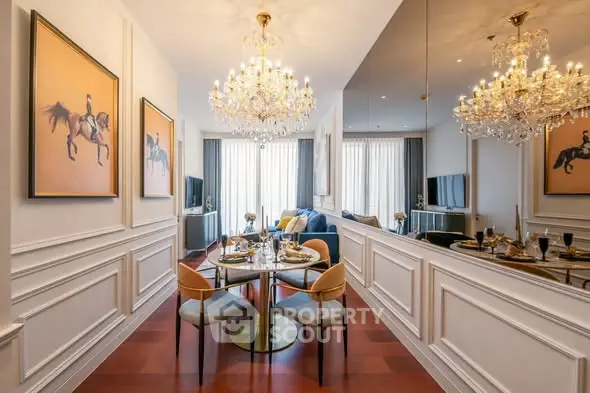 Luxurious dining area with elegant chandeliers and stylish decor in a modern apartment.