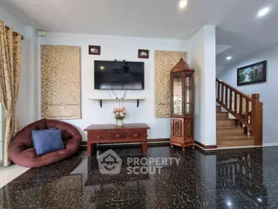 Elegant living room with modern decor and polished flooring