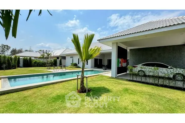 Luxurious modern villa with private pool and lush garden, perfect for serene living.