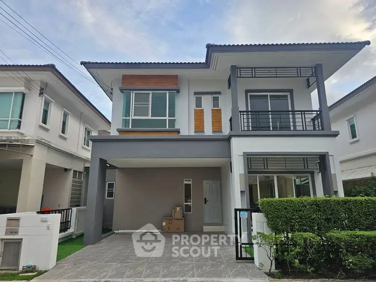 Modern two-story house with sleek design and spacious driveway