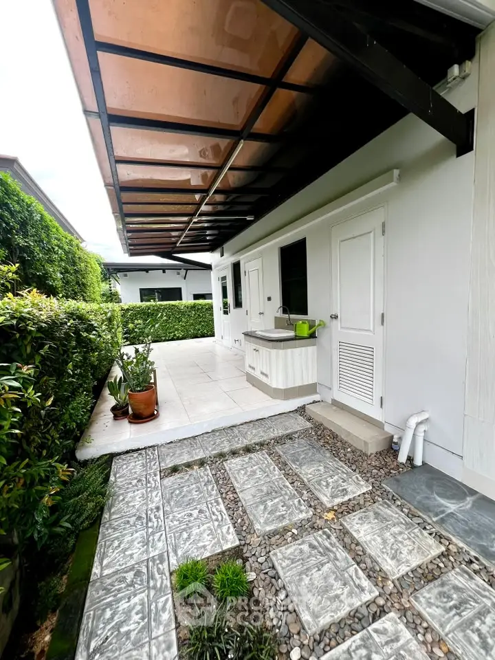Charming exterior view of modern home with lush garden and stylish walkway