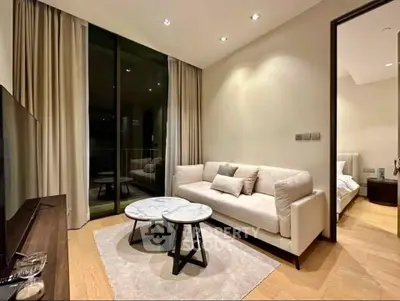 Modern living room with elegant decor and cozy ambiance, featuring a plush sofa and stylish coffee table.