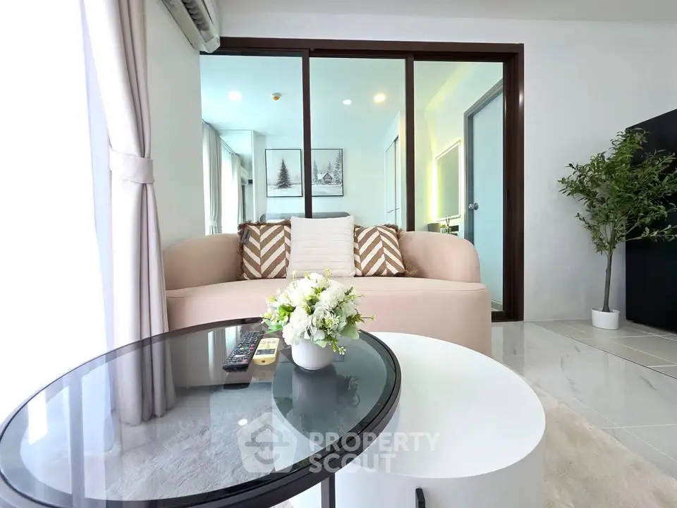 Modern living room with glass sliding doors and stylish decor