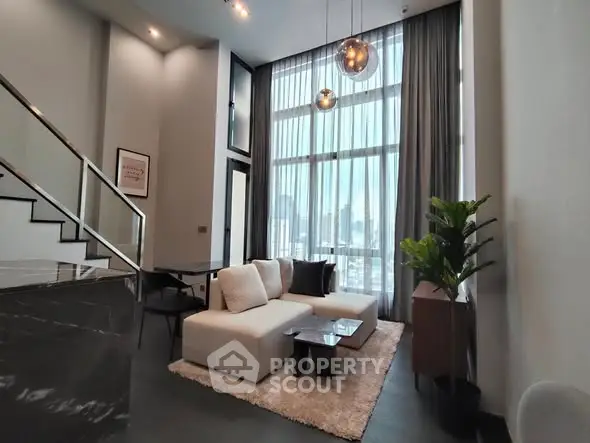 Luxurious living room with high ceilings and modern decor