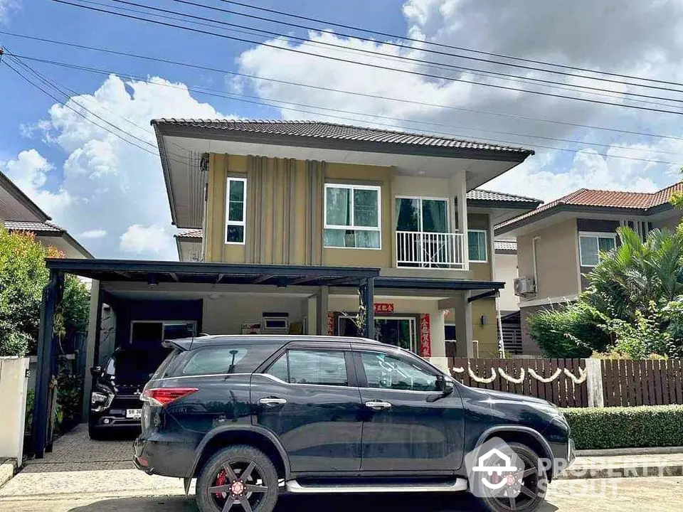 Modern two-story house with carport and parked SUV in suburban neighborhood