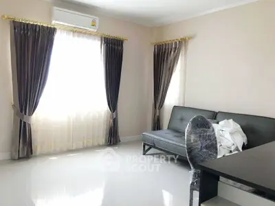 Bright living room with elegant curtains and modern furniture