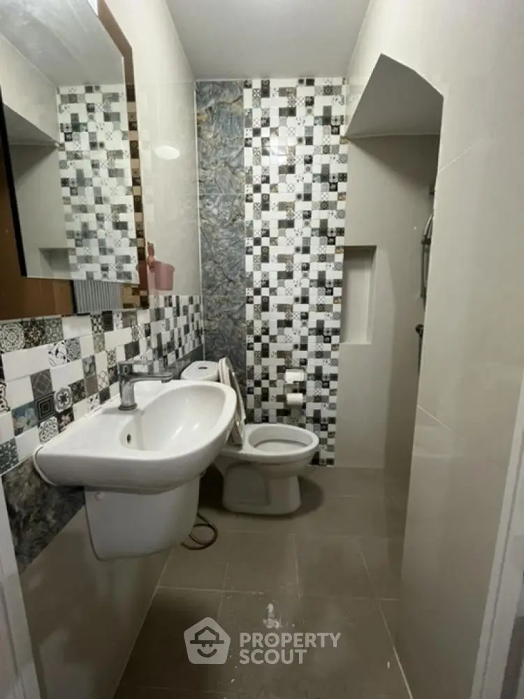 Modern bathroom with stylish tile design and sleek fixtures