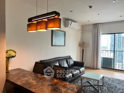 Modern living room with leather sofa and city view balcony