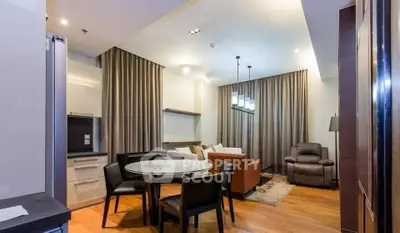 Modern living room with elegant lighting and cozy seating area, perfect for relaxation and entertainment.