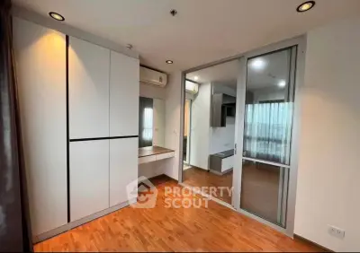 Modern apartment interior with wooden flooring and built-in wardrobe