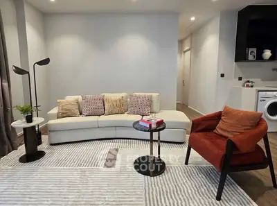 Stylish modern living room with cozy seating and contemporary decor.