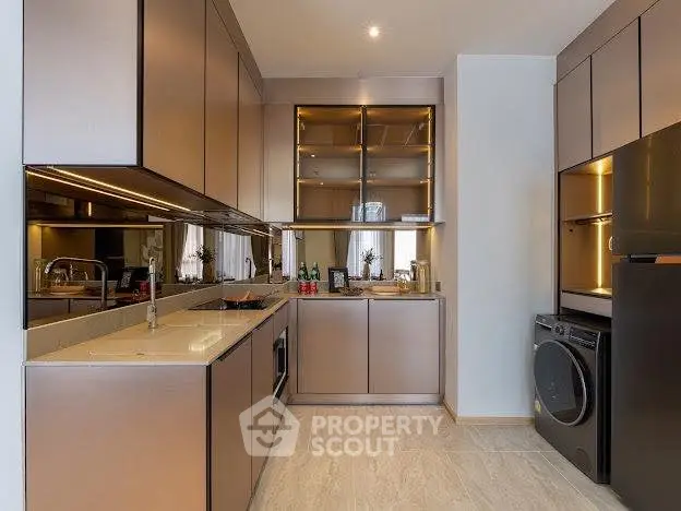 Modern kitchen with sleek cabinetry and built-in appliances