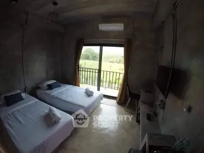 Modern bedroom with twin beds and balcony view, featuring minimalist design and natural light.