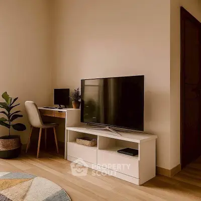 Modern living room with sleek TV stand and cozy workspace setup.