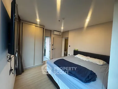 Modern bedroom with cozy lighting and sleek wardrobe design