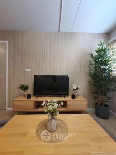 Stylish living room with modern decor and wooden furniture, perfect for cozy gatherings.