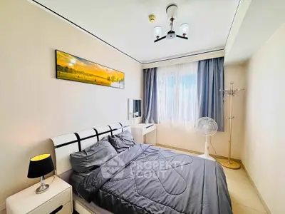 Cozy bedroom with modern decor and natural light, featuring a stylish bed and elegant furnishings.