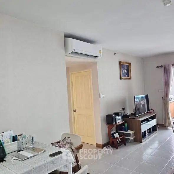 Cozy living room with air conditioning and modern entertainment setup