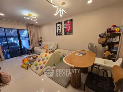 Spacious living room with modern decor and children's play area
