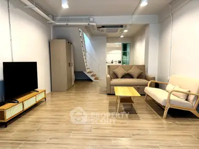 Spacious modern living room with stylish furniture and open layout, perfect for relaxation and entertainment.