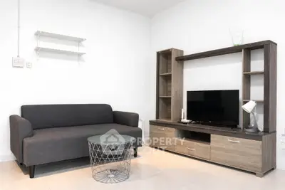 Modern living room with sleek furniture and entertainment center