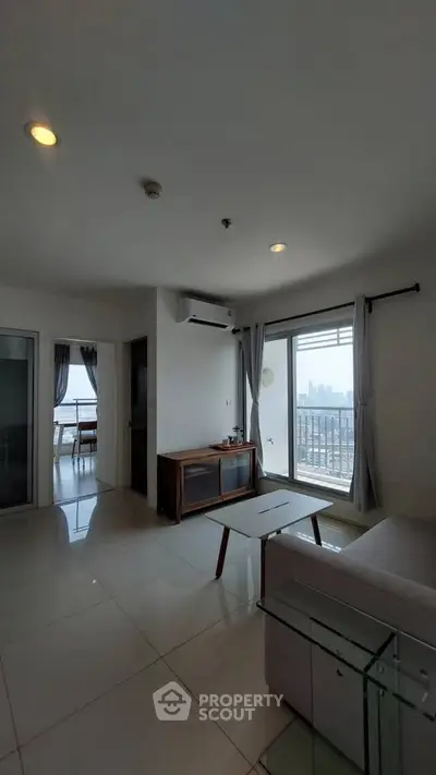 Modern living room with city view and sleek furniture