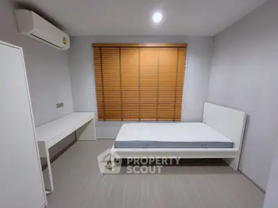 Minimalist bedroom with modern furniture and natural light