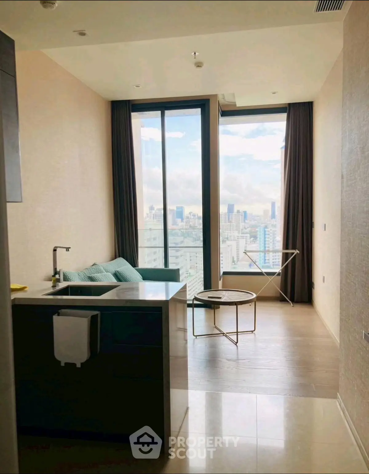 Modern living room with panoramic city view and stylish furniture
