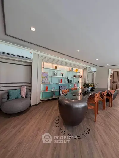 Modern living room with stylish furniture and elegant decor, featuring a sleek table and comfortable seating.