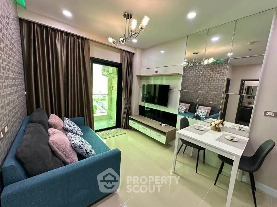 Modern living room with stylish decor and balcony access in a chic apartment.