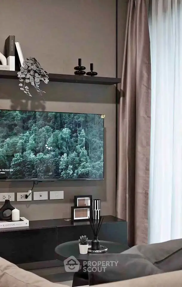 Modern living room with sleek decor and wall-mounted TV, perfect for stylish urban living.