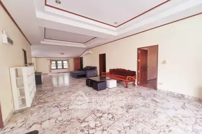 Spacious living room with marble flooring and elegant ceiling design