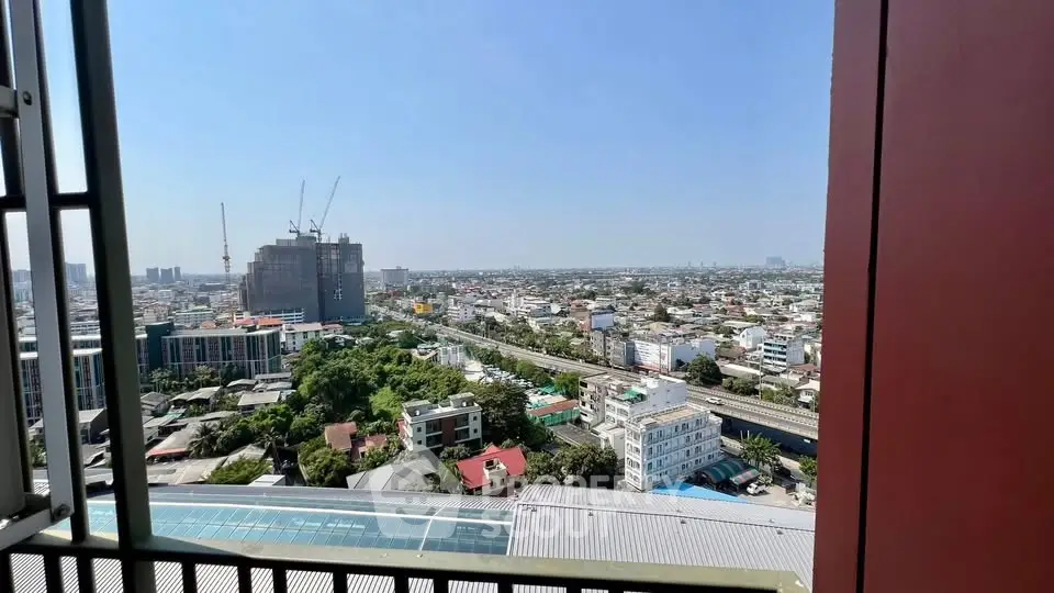 Stunning cityscape view from high-rise balcony with expansive skyline and urban landscape.