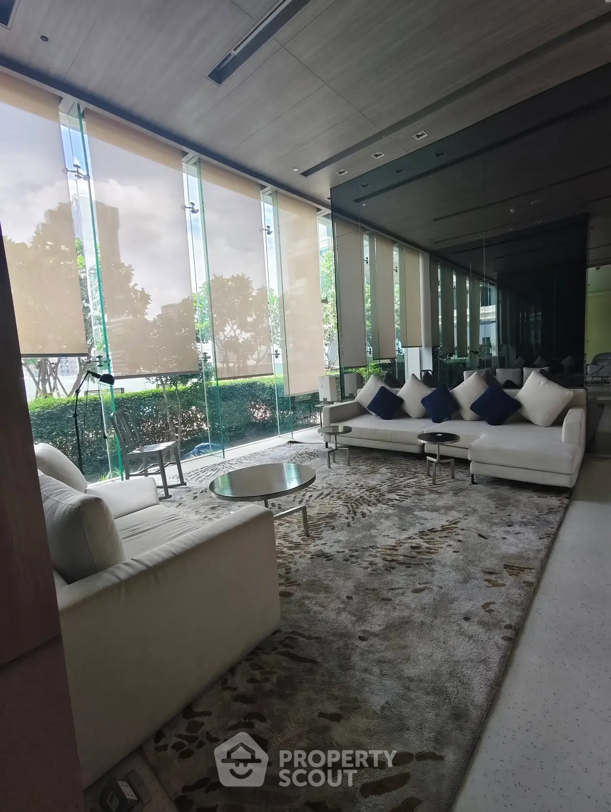 Luxurious modern living room with floor-to-ceiling windows and elegant decor
