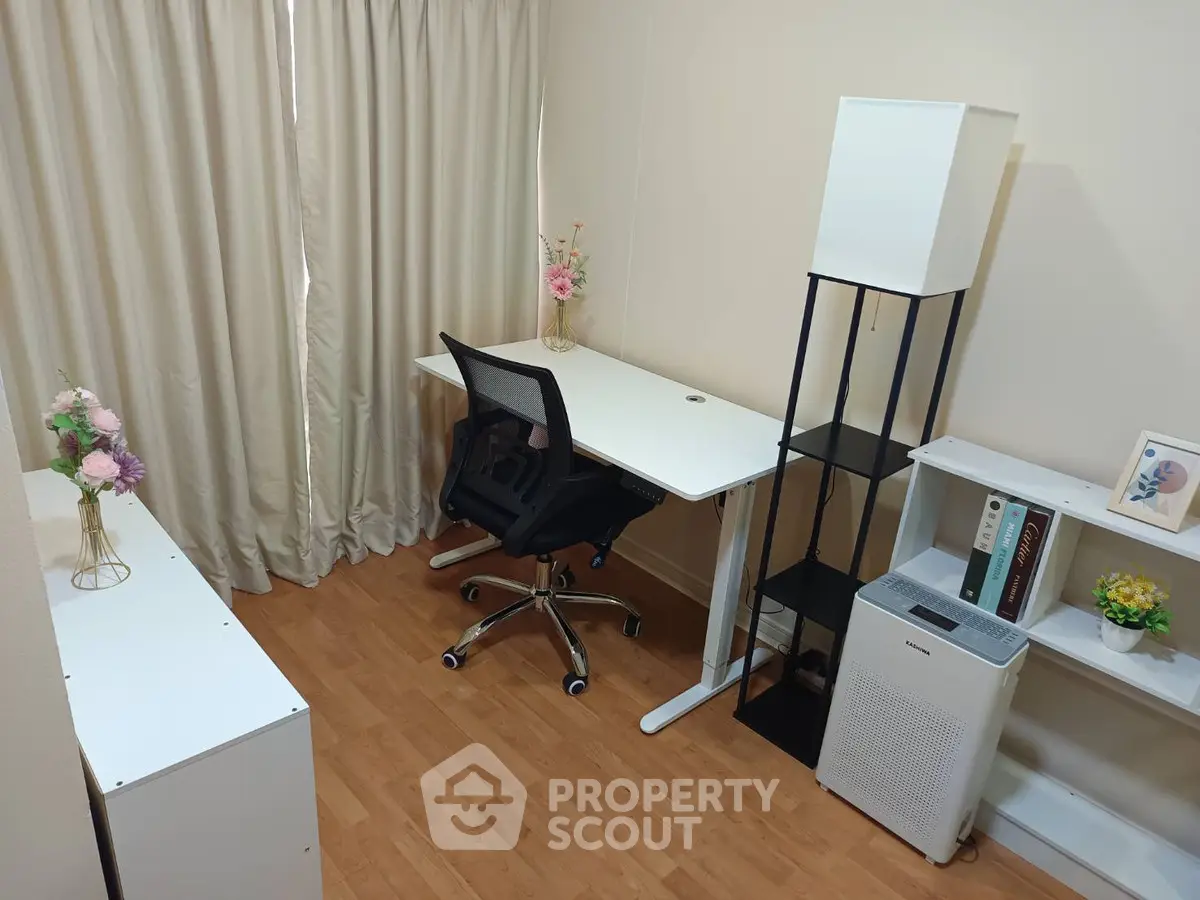 Modern study room with sleek desk, ergonomic chair, and stylish shelving in a cozy setting.
