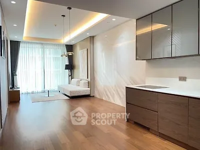 Spacious modern living room with open kitchen and elegant wooden flooring
