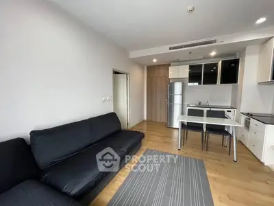 Modern living room with sleek kitchen in open layout apartment