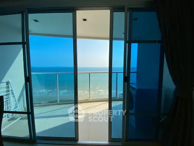 Stunning ocean view from modern balcony with glass doors