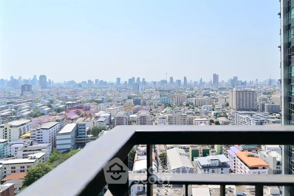 Stunning cityscape view from a high-rise balcony, perfect for urban living enthusiasts.