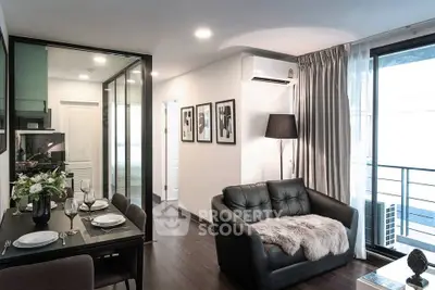 Modern living room with elegant decor and balcony access in a stylish apartment.