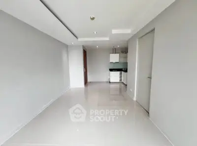 Spacious modern living room with sleek tile flooring and minimalist design