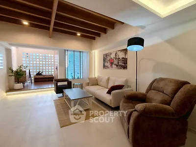 Spacious living room with modern decor and cozy seating area