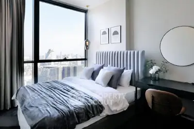 Luxurious bedroom with stunning city view and modern decor