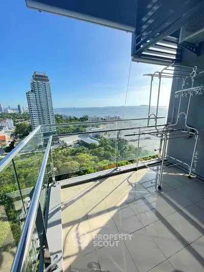 Stunning balcony with panoramic city and ocean views, perfect for relaxation and enjoying the skyline.